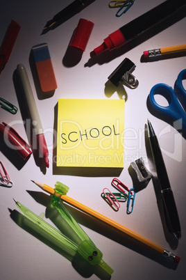 School against students table with school supplies