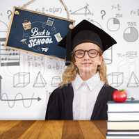 Composite image of cute pupil in graduation robe