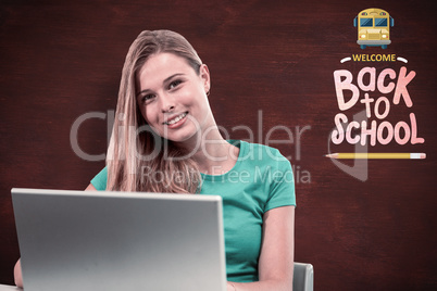 Composite image of student on laptop