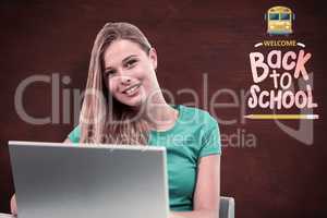 Composite image of student on laptop