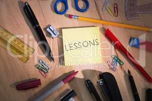 Lessons against students table with school supplies