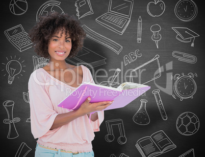 Composite image of beautiful woman holding photo album and smili