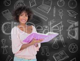 Composite image of beautiful woman holding photo album and smili