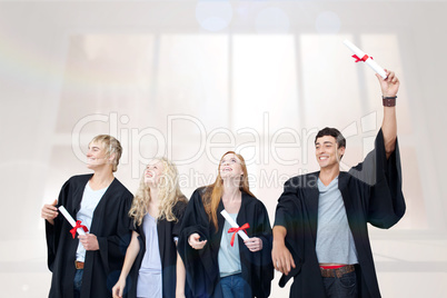 Composite image of group of people celebrating after graduation