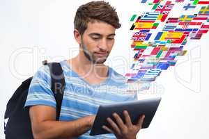 Composite image of male college student using digital tablet