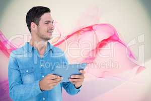Composite image of handsome man holding digital tablet over whit