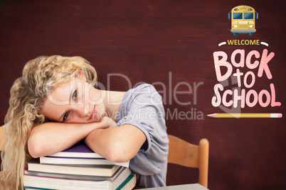 Composite image of tired teeenager sleeping in a library