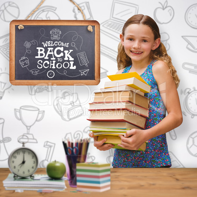 Composite image of cute little girl carrying books in library