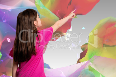 Composite image of cute little girl pointing with finger