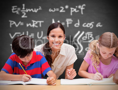 Composite image of pretty teacher helping pupils in library