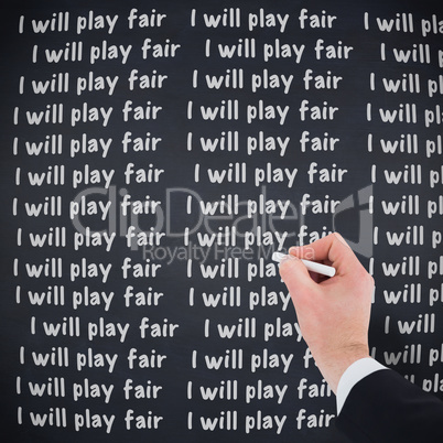 Composite image of hand of businessman writing with a white chal