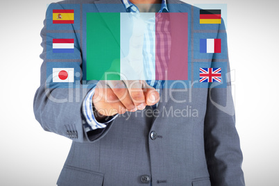 Composite image of focused businessman pointing