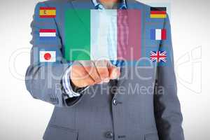 Composite image of focused businessman pointing