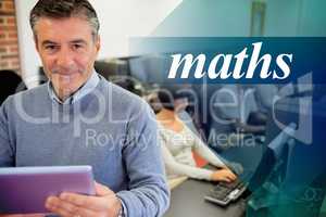 Maths against teacher holding a tablet pc