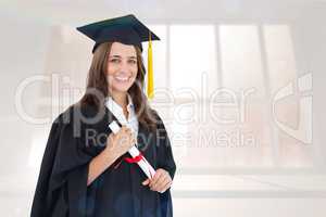 Composite image of a smiling woman with her degree as she looks
