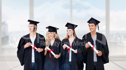 Composite image of group of people celebrating after graduation