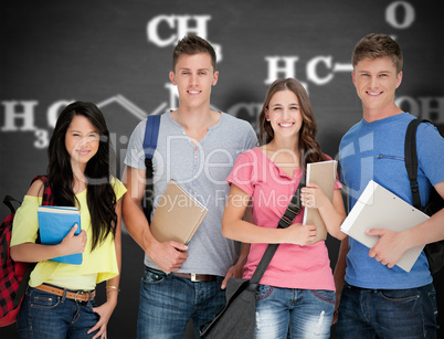 Composite image of students looking at the camera as they hold n