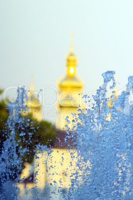 fountains on the background of golden domes