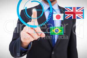 Composite image of businessman pointing his finger at camera