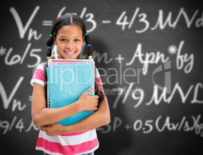 Composite image of cute pupil smiling at camera in library