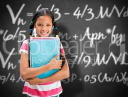 Composite image of cute pupil smiling at camera in library