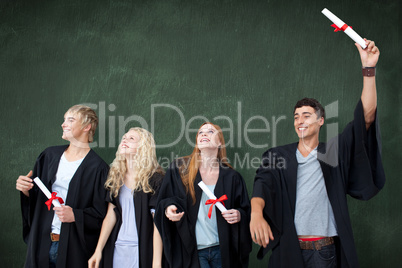 Composite image of group of people celebrating after graduation