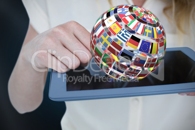 Composite image of woman using tablet pc