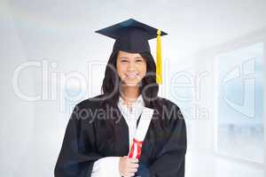 Composite image of woman with her degree dressed in her graduati