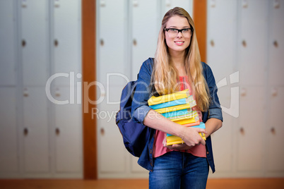 Composite image of pretty student in the library