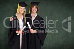 Composite image of two students in graduate robe shoulder to sho