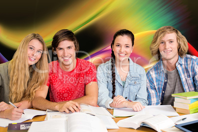 Composite image of college students doing homework in library