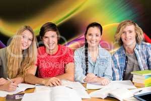 Composite image of college students doing homework in library