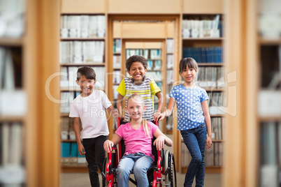 Composite image of cute disabled pupil smiling at camera with he