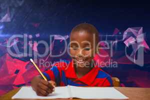 Composite image of pupil working at desk