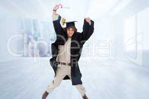 Composite image of male student in graduate robe jumping