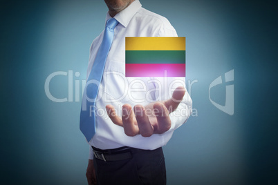 Composite image of businessman holding hand out