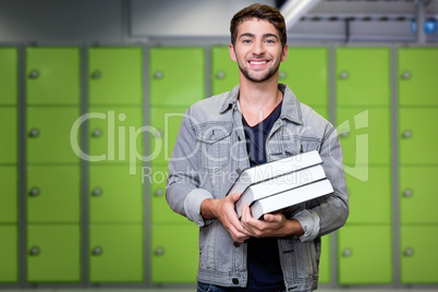 Composite image of student smiling at camera in library