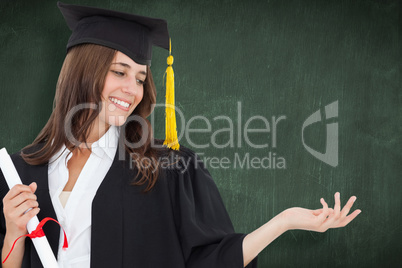 Composite image of a smiling woman with a degree as she opens ou
