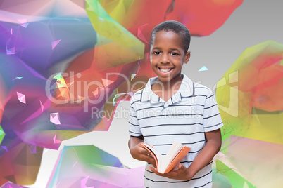 Composite image of happy pupil with book