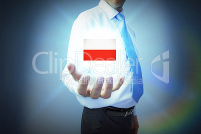 Composite image of businessman holding hand out