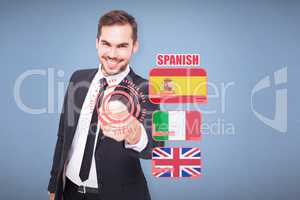 Composite image of happy businessman pointing at camera