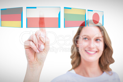 Composite image of pretty woman pointing with her finger