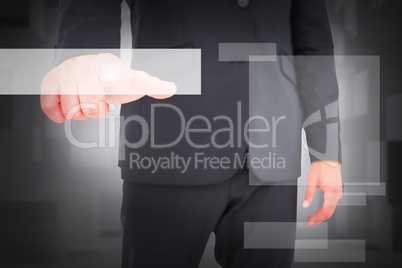 Composite image of businessman pointing with finger