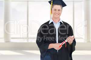 Composite image of man smiling as he has just graduated with his