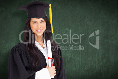 Composite image of a woman standing to the side slightly with he