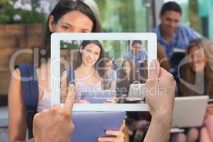 Composite image of hand holding tablet pc