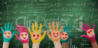 Composite image of hands with colourful smiley faces Composite image of hands with colourful smiley faces
