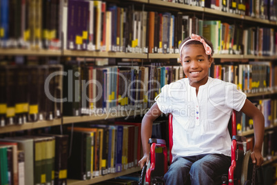 Composite image of girl sitting in wheelchair in school corridor