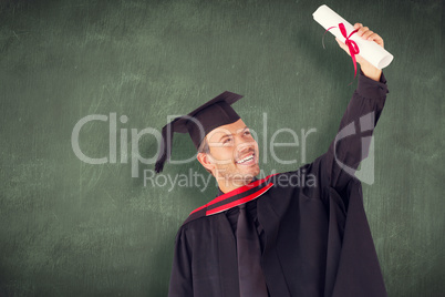 Composite image of happy attractive boy celebrating his graduati