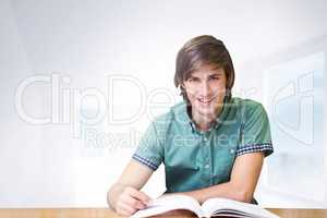 Composite image of student sitting in library reading